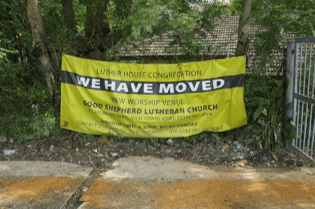 luther house we have moved sign
